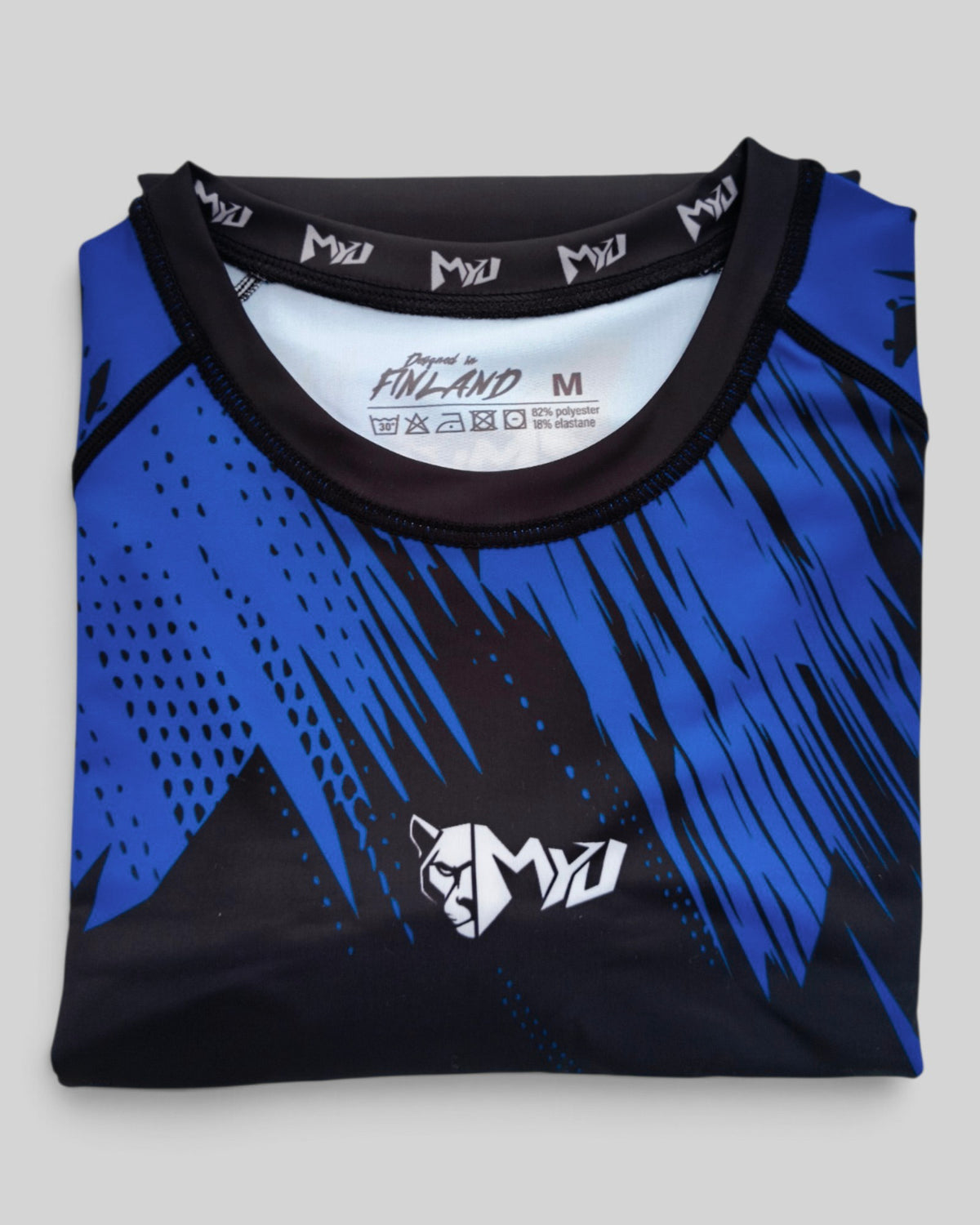 MYU Blue Ranked rashguard, IBJJF blue belt rank short-sleeve no-gi BJJ top — folded front view
