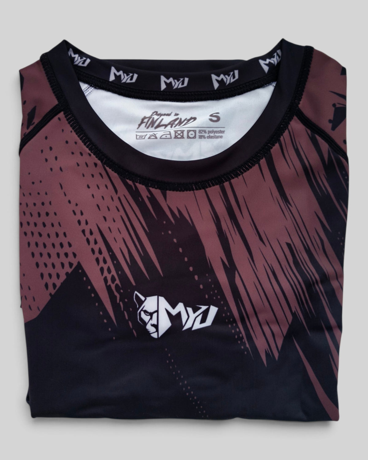 MYU Brown Ranked rashguard, IBJJF brown belt rank short-sleeve no-gi BJJ top — folded front view