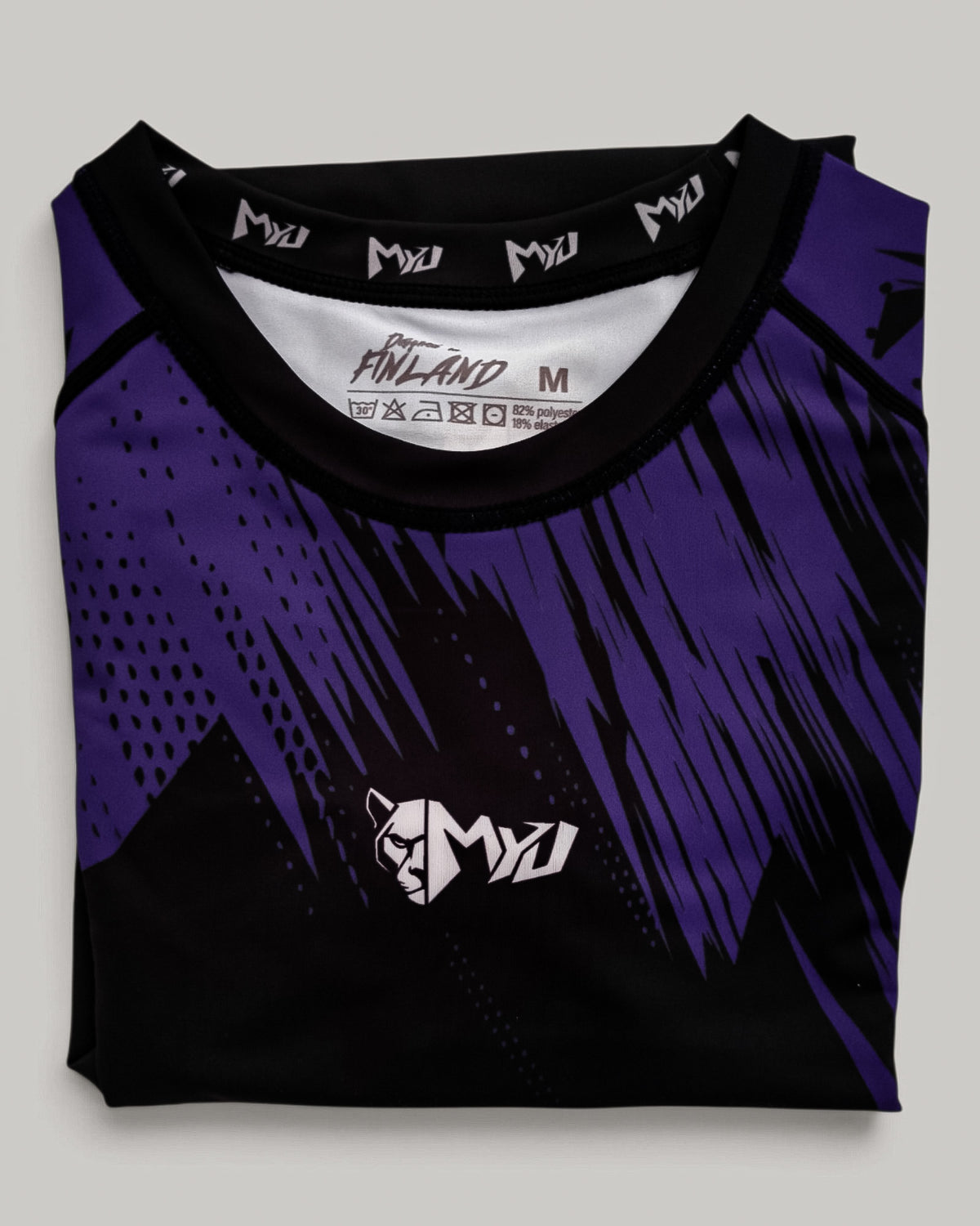 MYU Purple Ranked rashguard, IBJJF purple belt rank short-sleeve no-gi BJJ top — folded front view