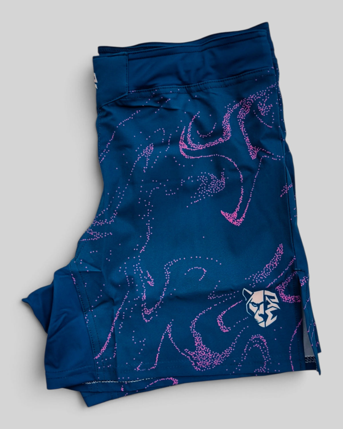 MYU Ocean Marble fight shorts, blue marbled grappling and MMA shorts — folded side angle