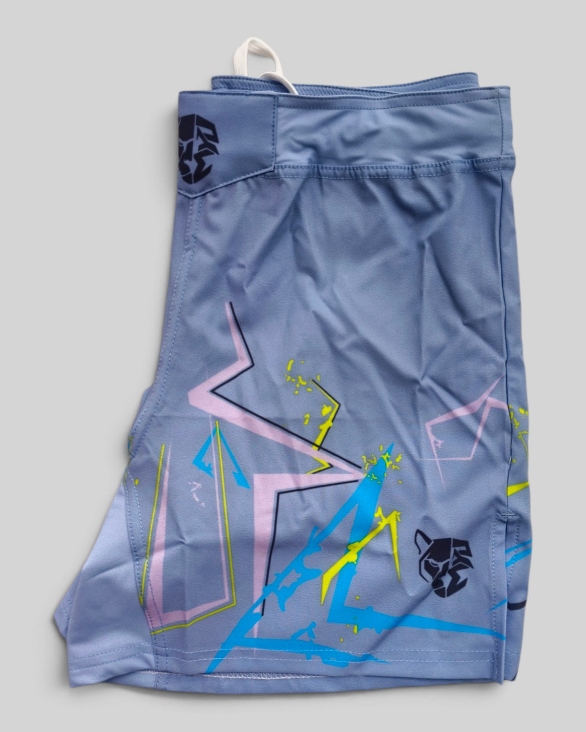 MYU Ice Blue Lightning fight shorts, powder blue grappling and MMA shorts — folded side angle