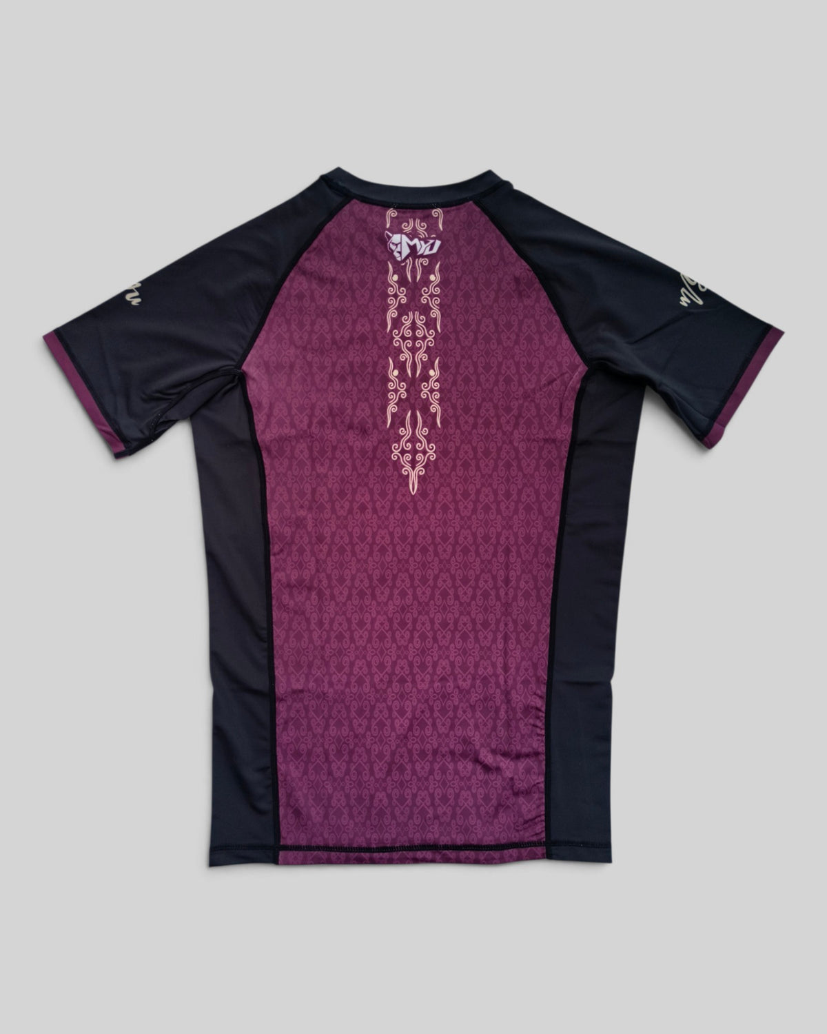 MYU Crimson Ornamental rashguard, crimson short-sleeve BJJ top with ornamental pattern — folded front view