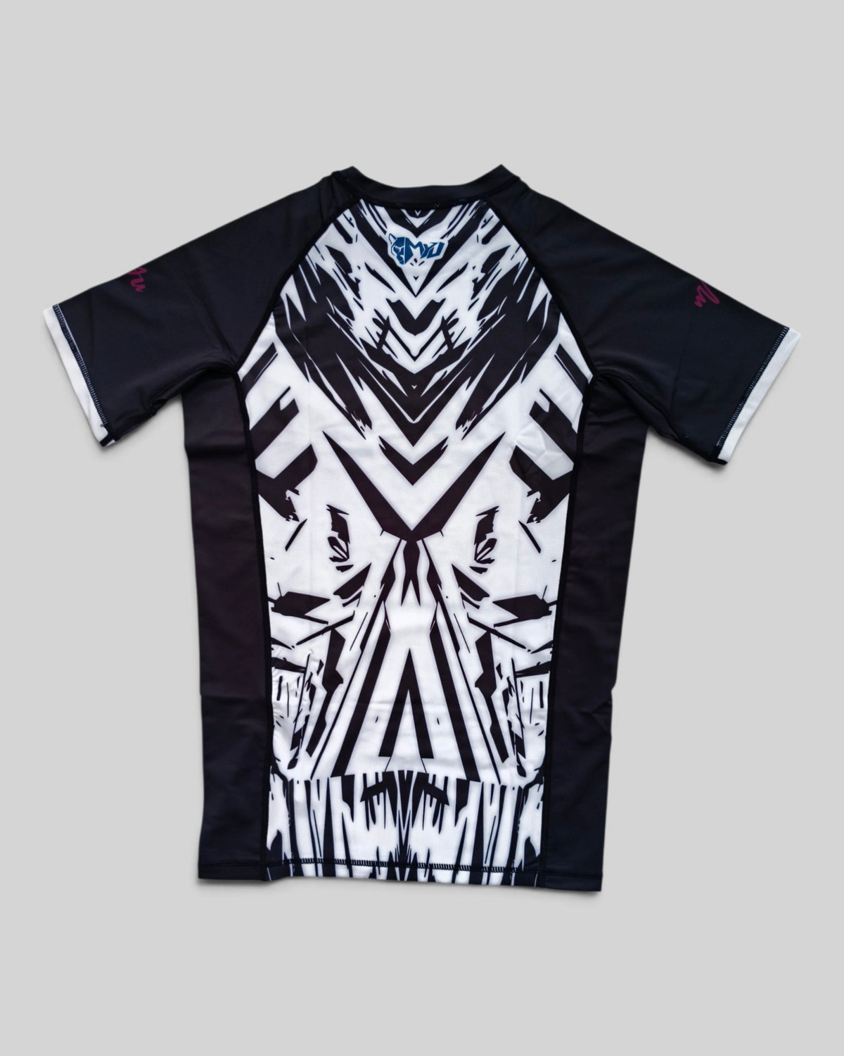 MYU Ink Explosion rashguard, short-sleeve BJJ compression top with ink splatter print — folded front view