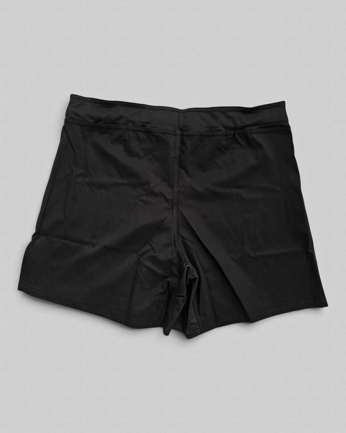 MYU Black fight shorts, plain black grappling and MMA shorts — back view