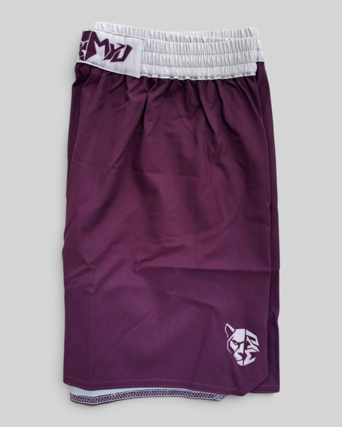 MYU Bordeaux fight shorts, deep red grappling and MMA shorts — folded side angle