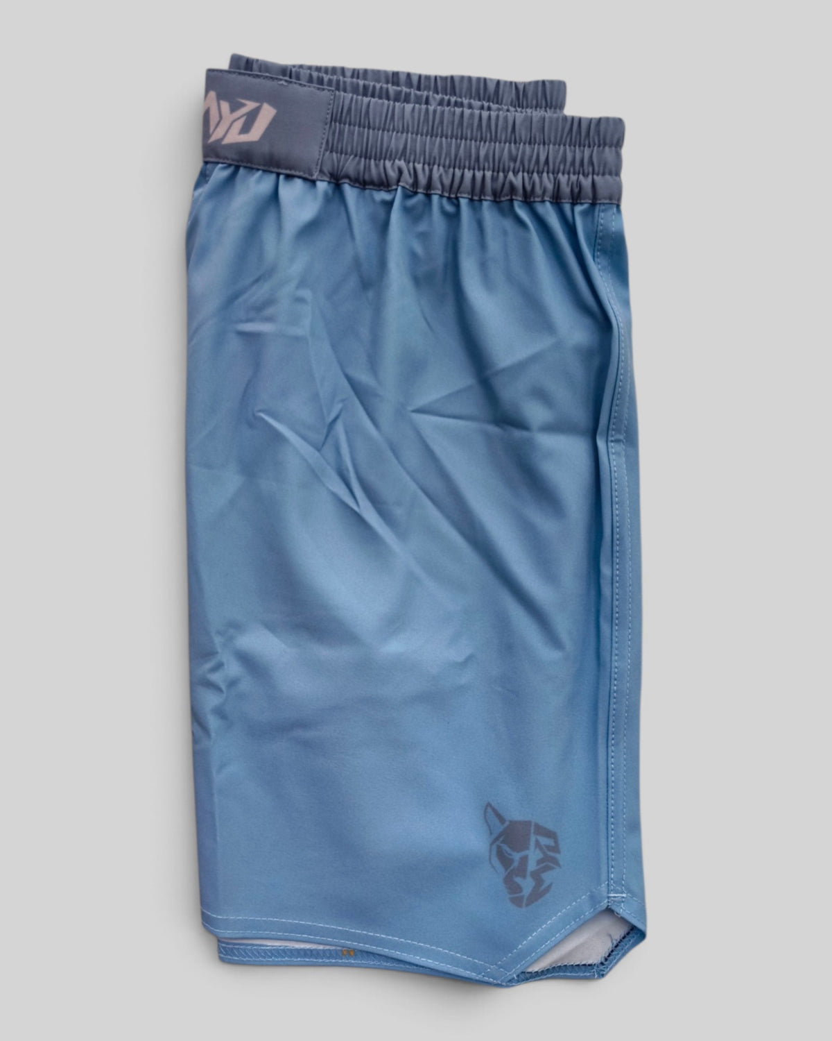 MYU Glacial Blue fight shorts, pale blue grappling and MMA shorts — folded side angle