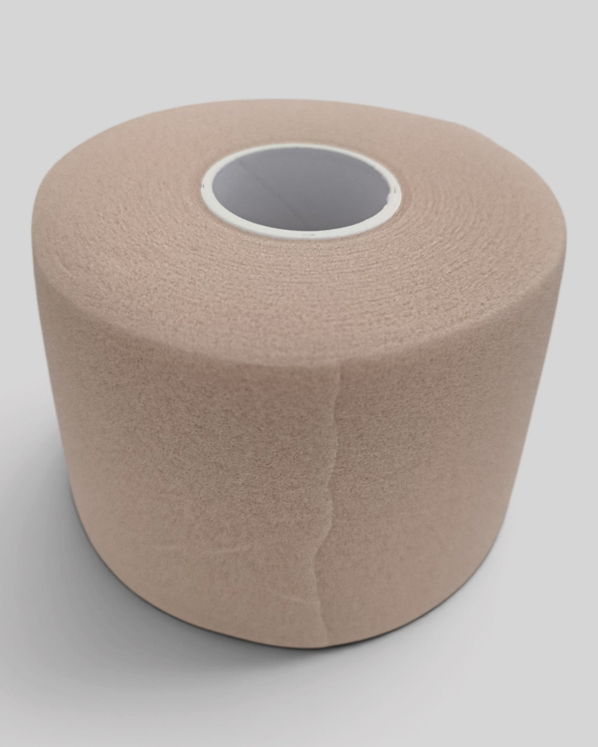 MYU foam underwrap roll used as a base layer under athletic tape — close-up detail